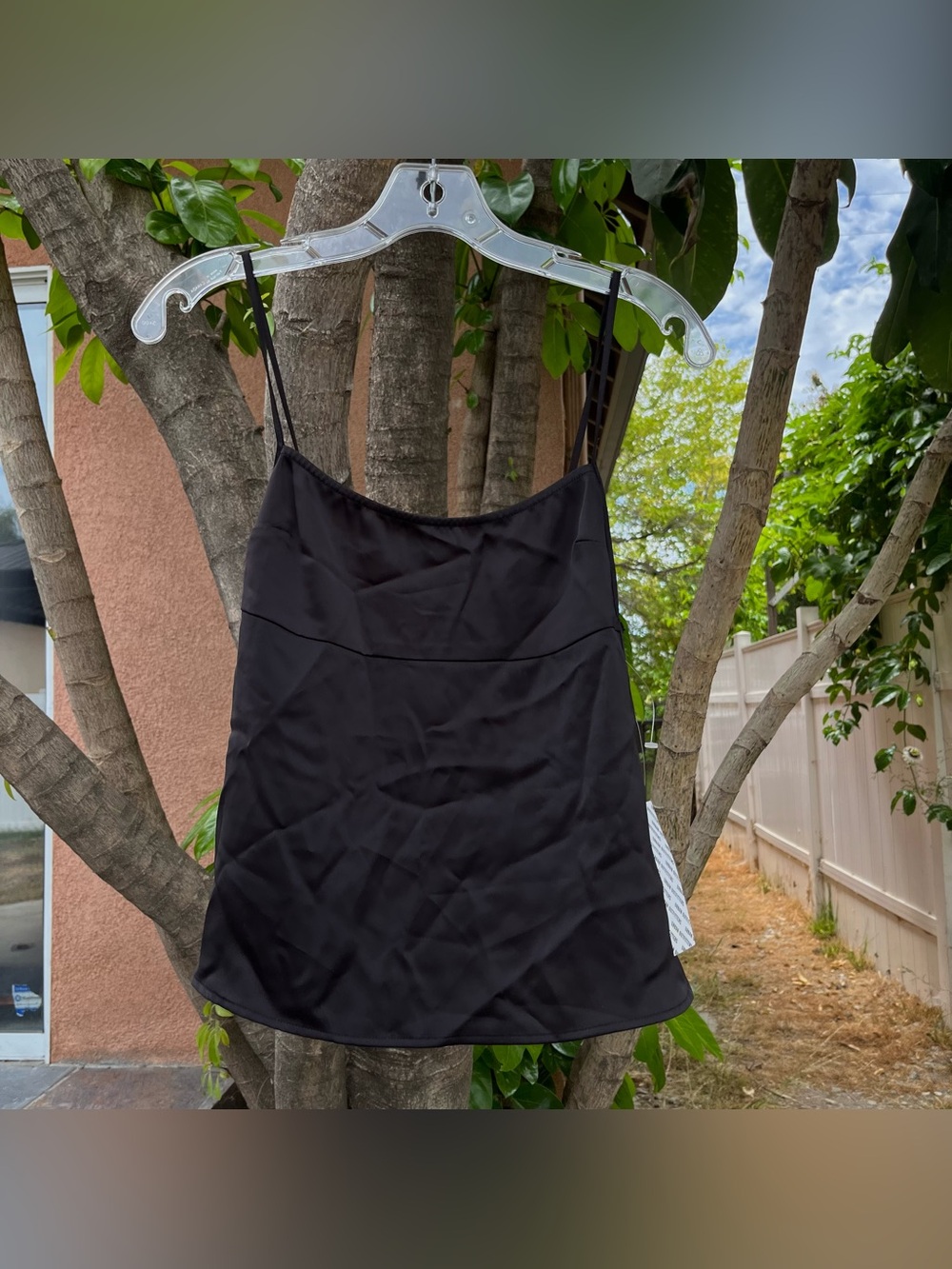 NWT Urban Outfitters Black Top with an Intricate Back Design .